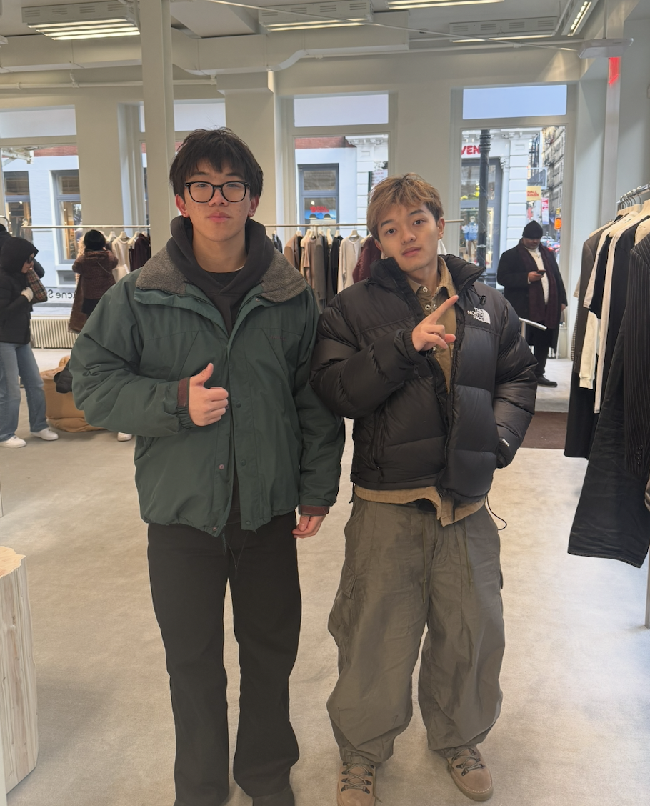 Owen Fang standing with a friend indoors